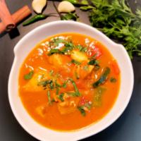 Fish Curry · boneless fish, seasoned with herbs, turmeric, garlic, and ginger. cooked with fresh tomato.