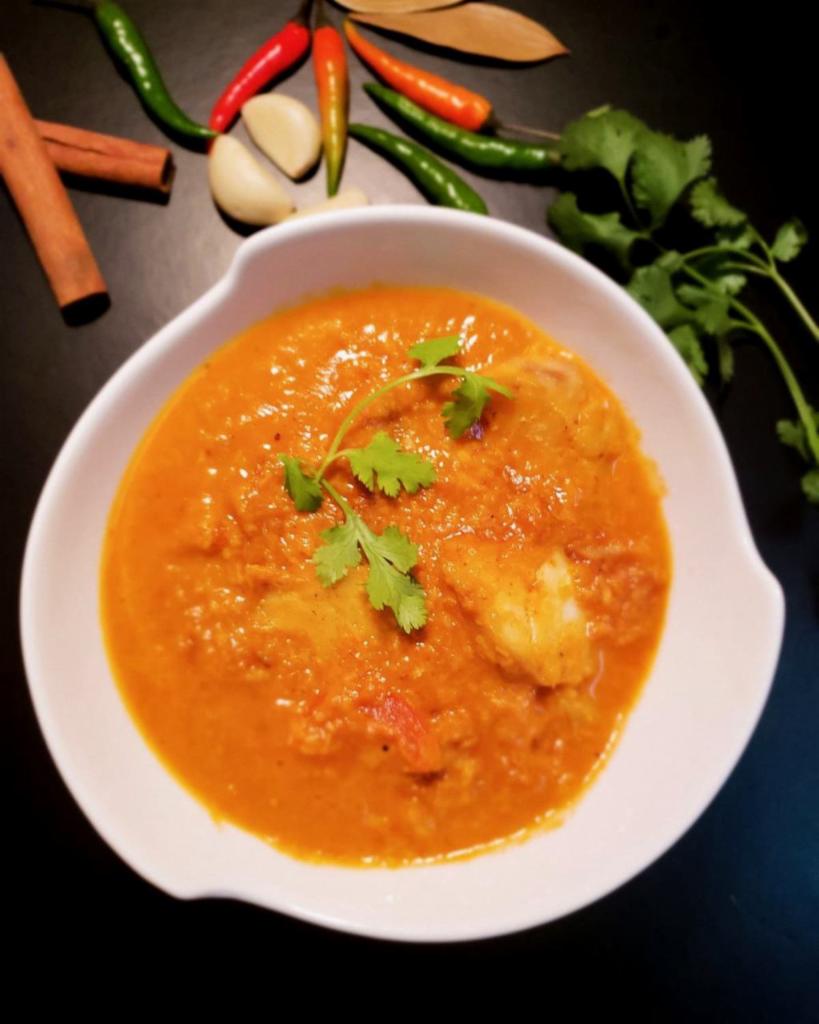 Coconut Fish · Boneless fish seasoned with herbs, turmeric, garlic, and ginger in a coconut milk-based sauce. 