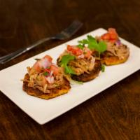 Arepita Sliders · 3 crispy sweet corn cakes topped with choice of: vaca frita (shredded beef). Served with cre...