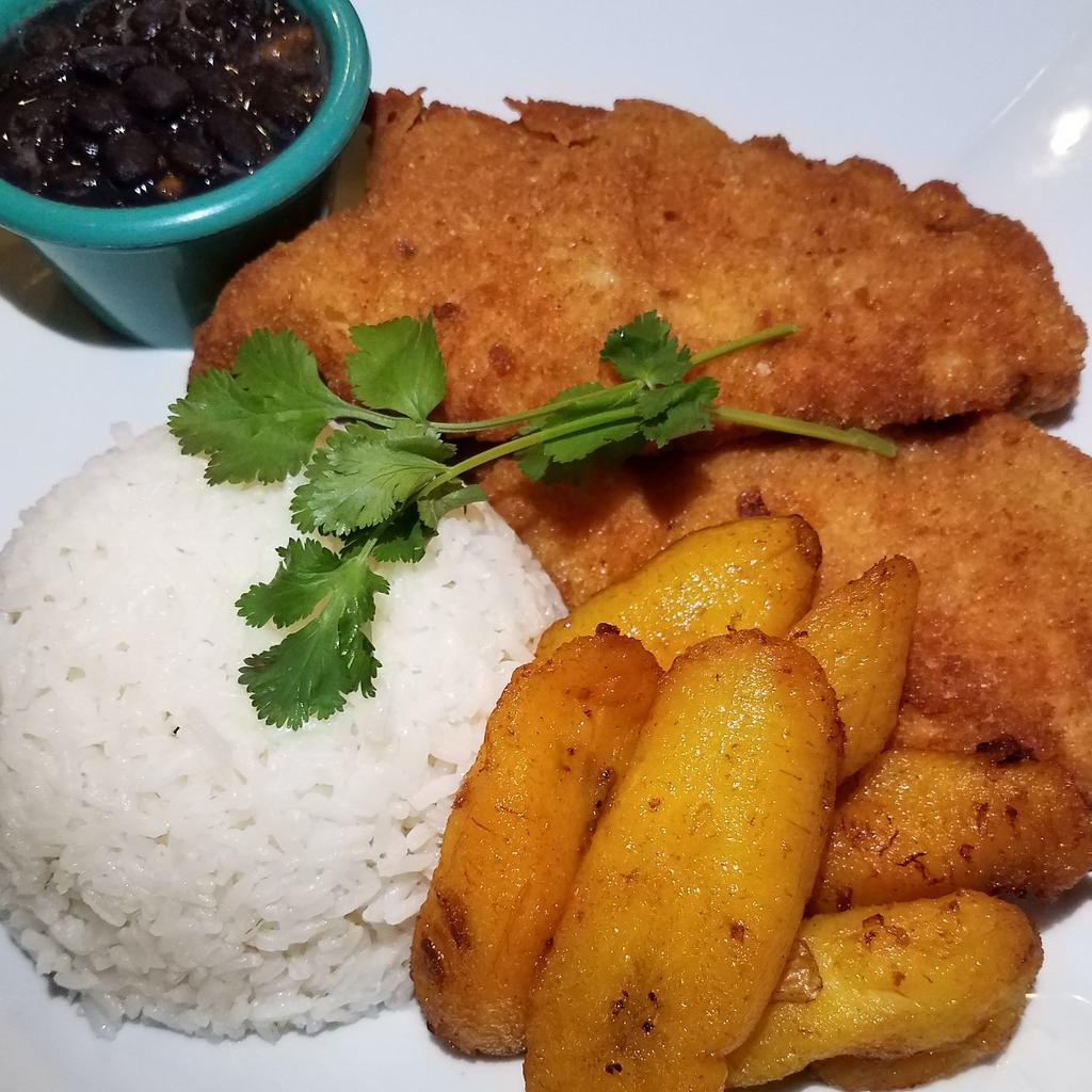 Breaded Chicken Cutlet Dinner Plate · Boneless chicken breast filleted and breaded, and served with either arroz con gandules (yellow rice and pigeon peas) or white rice with red or black beans and maduros (sweet plantains) OR tostones (fried crispy green plantains) 