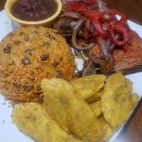 Pork Chops Dinner Plate · Fried pork chops with caramelized onions, and served with either arroz con gandules (yellow ...