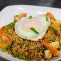 Bodega Fried Rice (Chaulafan) · Fried rice made with chicken, pork belly, shrimp, onions, scallions, garlic, peppers, pigeon...