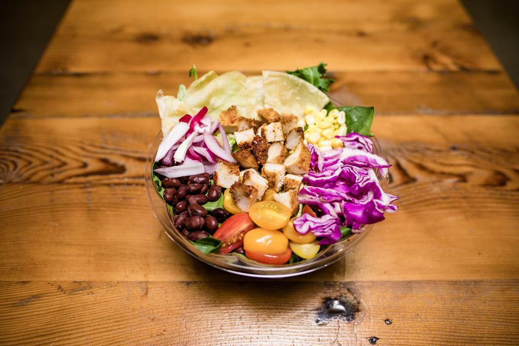 Taco Salad · Chicken, organic tortilla, corn, black beans, tomato, cabbage, red onion, and house greens.