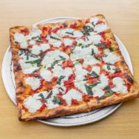 Nonno Sal's Brooklyn Pie · Thing crust square pizza, crushed tomatoes, fresh mozzarella, olive oil, and fresh basil.