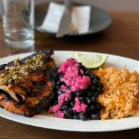 Chicken al Carbon · Chicken breast marinated with guajillo, honey, and lime and grilled. Served with rice and bl...