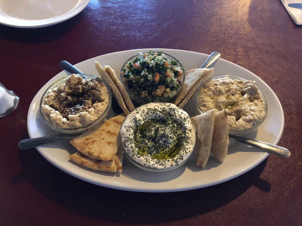 Appetizer Sampler (For 2-3 people) · Tabouleh, labneh, hummus and baba ghanoush. Served with 2 pitas. Vegetarian and vegan.