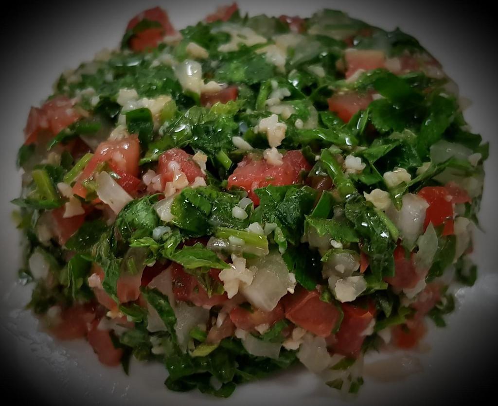 Tabouleh · Parsley salad with tomatoes, onion and wheat. Vegan.