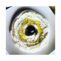 Labneh · Creamy plain yogurt with olive oil and spearmint.
