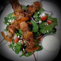 Shish Tawook Plate/Chicken Kebab/Brochetas de Pollo · 2 chicken skewers. Grilled, seasoned chicken breast skewers on salad with feta cheese and a ...