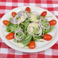 Arugula Salad · Arugula, cherry tomatoes, red onions and shaved Parmigiana in a balsamic vinegar.