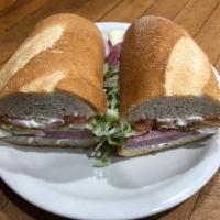 Ham, Salami and Provolone Sub · Includes lettuce, tomatoes, onions, oil and vinegar.