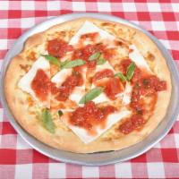 Margherita Pizza · Plum tomato, fresh mozzarella and fresh basil.