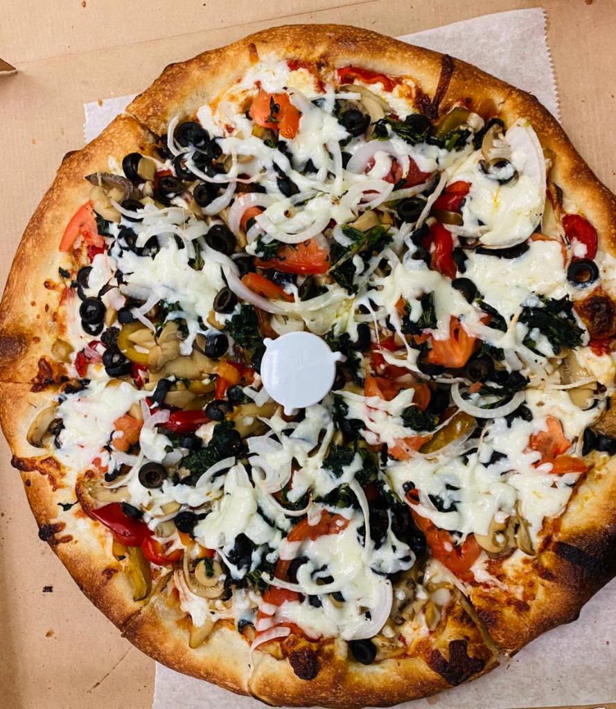 Vegetable Pizza · Spinach, tomato, peppers, mushrooms, onions and black olives. 