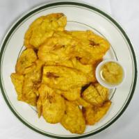 Tostones · Fried green plantain.