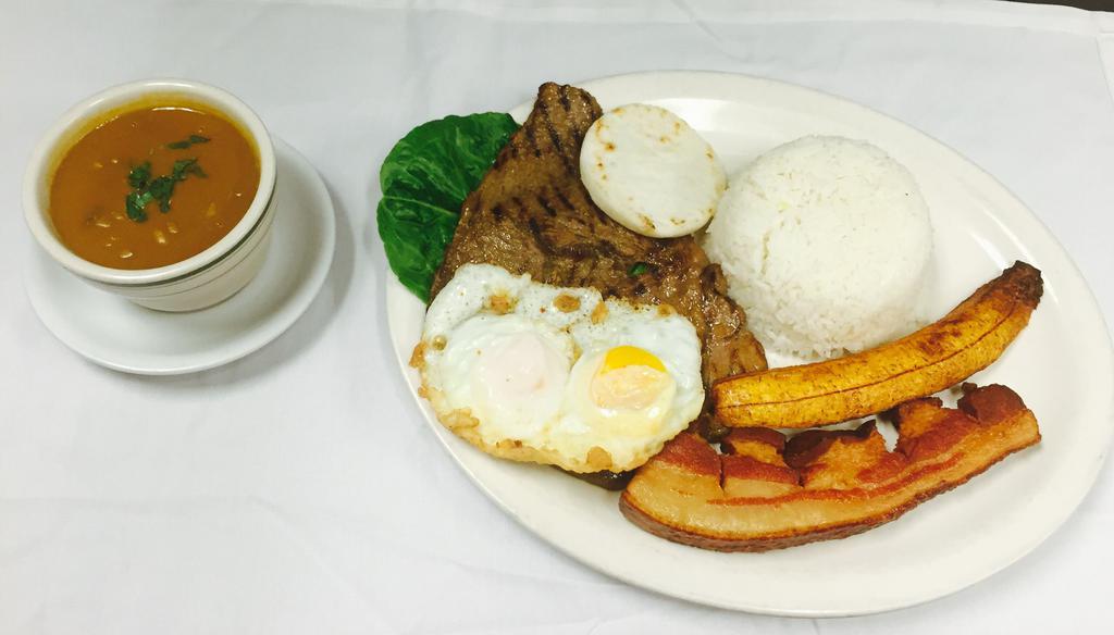 #4 Bandeja Montanera · Rice, beans, steak, fried pork skin, egg, corn cake and sweet plantain. 