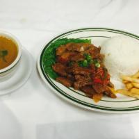 Lomo Saltado · Sauteed, diced beef with rice, beans and french fries. 