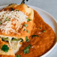 Chile Relleno · Poblano pepper filled with Oaxaca cheese in red tomato sauce. Served with rice and beans and...