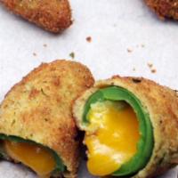 Jalapeno poppers - 6 pieces · Battered and fried jalapeno peppers stuffed with mix of cheeses (Oxaca, Cheddar)