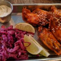 Chipotle honey chicken wings · Spicy chipotle chile sauce.