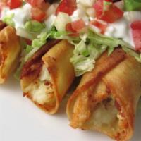 Flautas - 3 pieces · Fried rolled up tortilla stuffed with chicken and cheese. Side of black beans, lettuce, pico...
