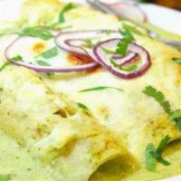 Enchiladas Suizas Verdes · 3 soft corn tortillas rolled and filled with choice of protein and cheese. Topped with hot m...