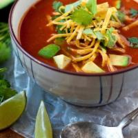 Tortilla soup  · Chicken tomato soup with crushed corn tortillas and avocado.