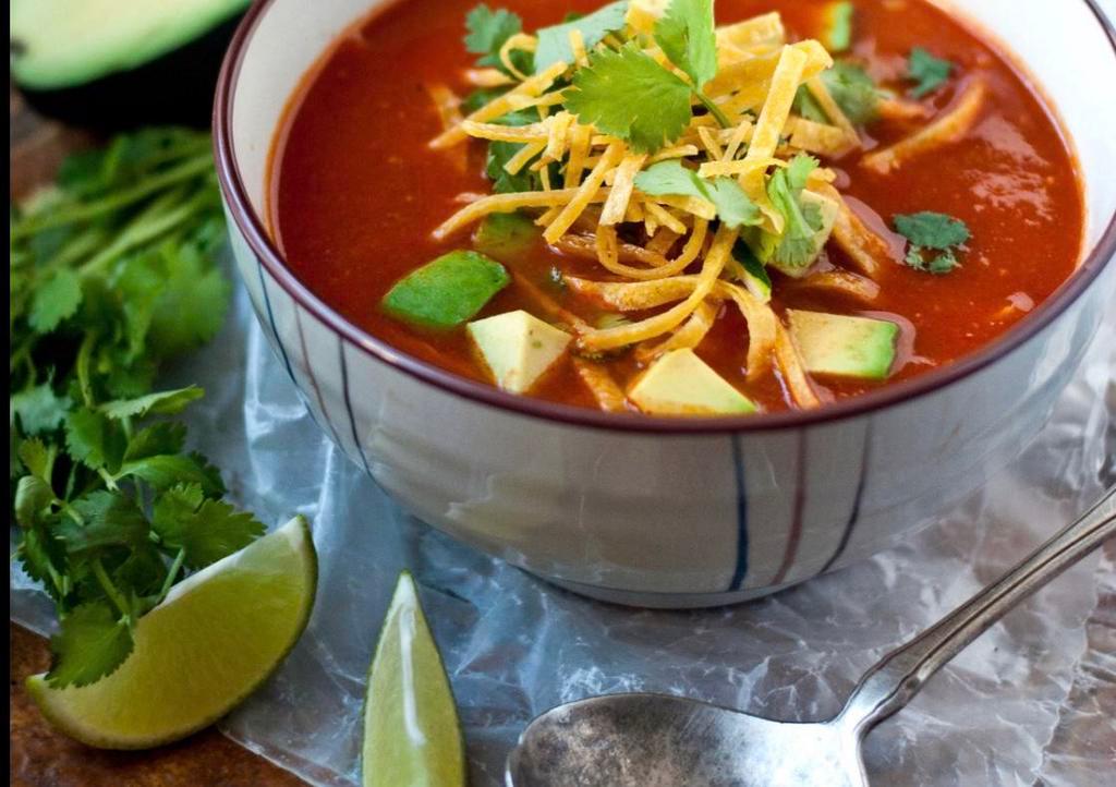 Tortilla soup  · Chicken tomato soup with crushed corn tortillas and avocado.