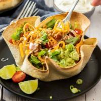 Taco Salad · Cheese, tomato, lettuce, black beans, sour cream, guacamole in tortilla shell