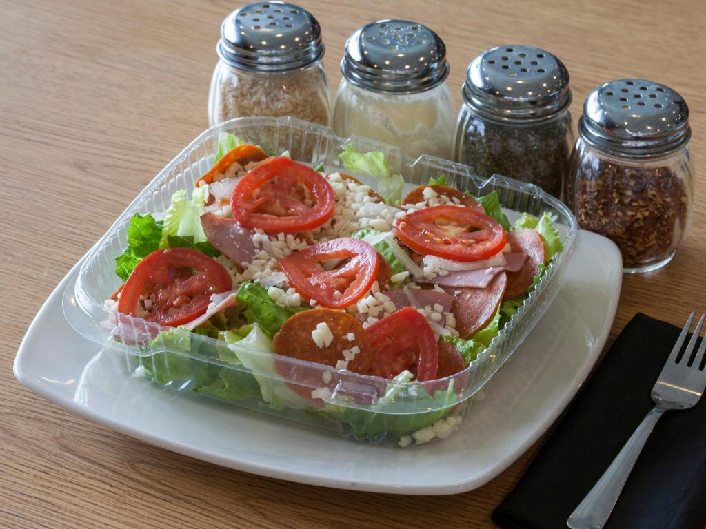 Chef Salad · Romaine lettuce, Canadian bacon, pepperoni, onions, tomatoes, mozzarella and your choice of dressing. 