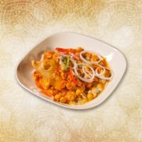 Melting Samosa Chaat · Classic samosas crushed and mixed with hot, sweet and tangy sauces, yogurt and topped with f...