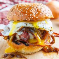 Texas Burger · Served with bacon, cheese and fried egg. Deluxe platter includes lettuce, tomatoes, french f...