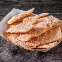 Sweet Crunch Strips · Cinnamon & sugar dusted crunchy flour tortilla strips.