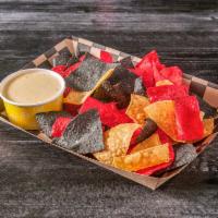 Chips N' Queso · Warm corn tortilla chips served with fresh made creamy queso