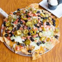 Pub Nachos · Corn tortilla chips topped wI think Mexico cheese mix, jalapenos, black
Beans, lettuce, Pico...
