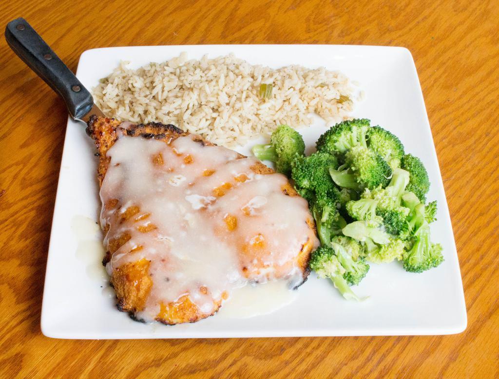 Cap'n Crunch Chicken · Chicken breast breaded in Cap'n Crunch cereal, pan-fried golden and topped with captain sauce. Served with vegetable of the day and rice.
