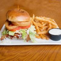 The Eddie Burger · BBQ sauce, cheddar cheese, bacon, onion ring with side of blue cheese dressing. Topped with ...