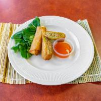 Egg Roll · 2 pieces. Crispy dough filled with minced vegetables and choice of chicken or pork. 