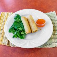 Vegetable Spring Roll · 2 pieces. Rice paper or crispy dough filled with shredded vegetables. 