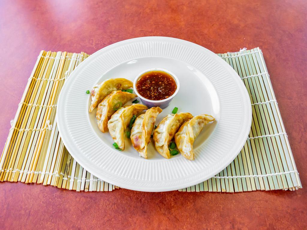 Gyoza · 6 pieces. Dumpling with a minced filling. 