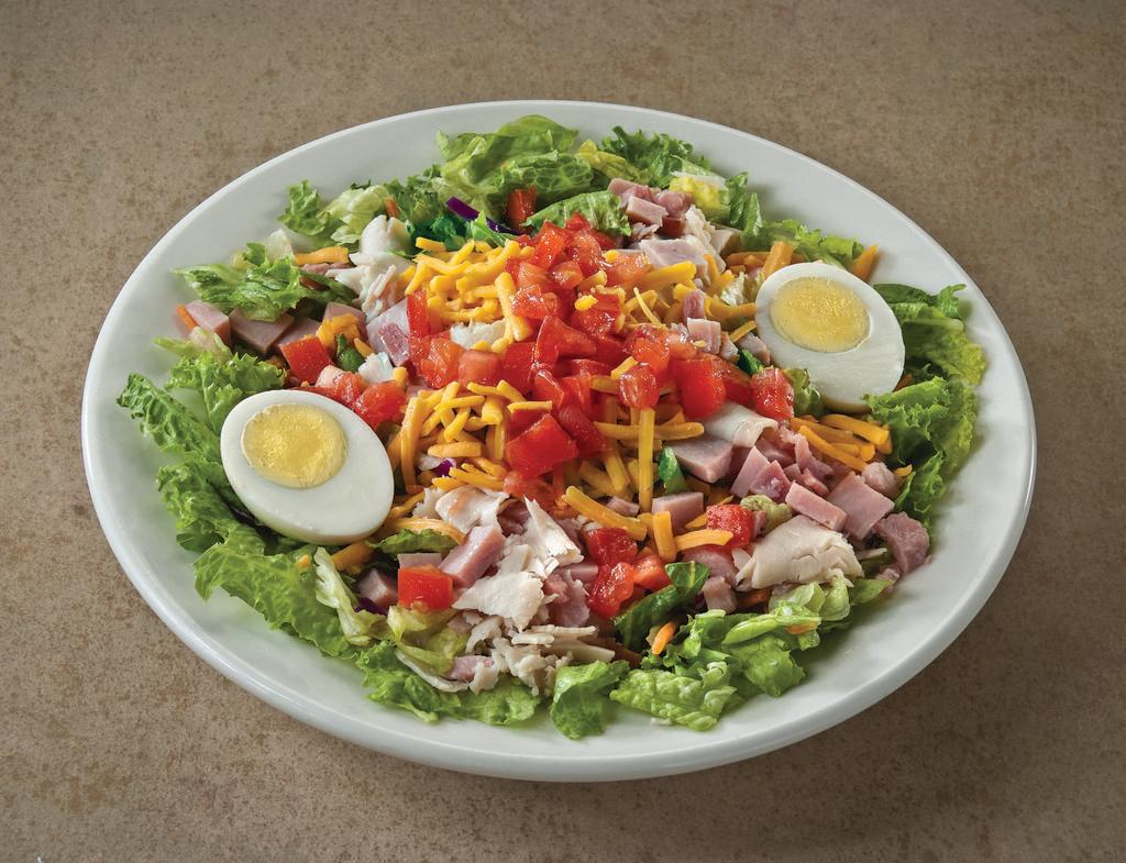 Chef's Salad · Crisp lettuce with turkey, ham, cheese, tomato and hard cooked egg, served with choice of dressing. Gluten free.