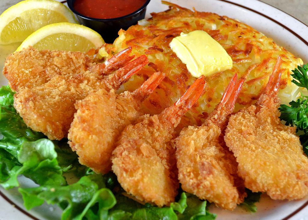 Fantail Shrimp Dinner · 6 pieces golden fried fantail shrimp served with tangy cocktail sauce and your choice of potato or mixed rice.