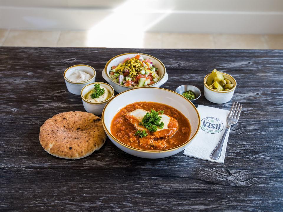 Vish Breakfast · Moroccan sweet red pepper and spicy tomato sauce, 2 poached eggs, Small chopped salad, Hummus dip, Tahini dip