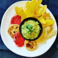 Guacamole and Arepas · Freshly made Guacamole served with homemade Arepas, tortilla chips and banana chips