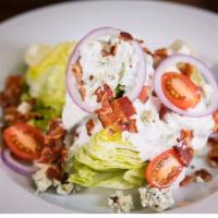 Wedge Salad · Iceberg Lettuce, Bacon, Tomato, Red Onion, Grilled Panela Cheese
Tossed in Blue Cheese Dress...