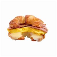 Local · Thick cut smoked black forest ham, fresh eggs, fontina cheese on a croissant.