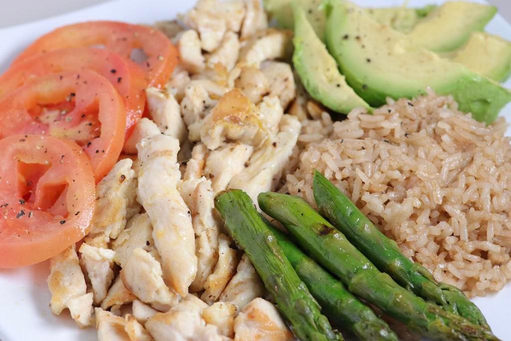 Goddess · Boneless chicken breast on a bed of brown rice mixed with asparagus, 1/2 avocado, scallions, and cherry tomatoes. 