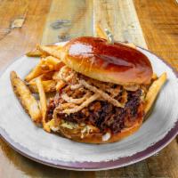 Pulled Pork Sandwich  **new menu item** · Eight hour hickory smoked pork butt, tossed in a chipotle BBQ sauce, honey coleslaw and cris...