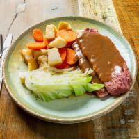 Corned Beef and Cabbage · Slowly braised tender brisket served with steamed cabbage, carrots, and boiled potatoes. Ser...