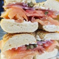 Lox Sandwich · Salmon, capers, red onion, tomato, on a bagel with cream cheese.