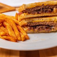 Patty Melt · 2 Beef patties with cheese melted and sauteed onions on sourdough bread.